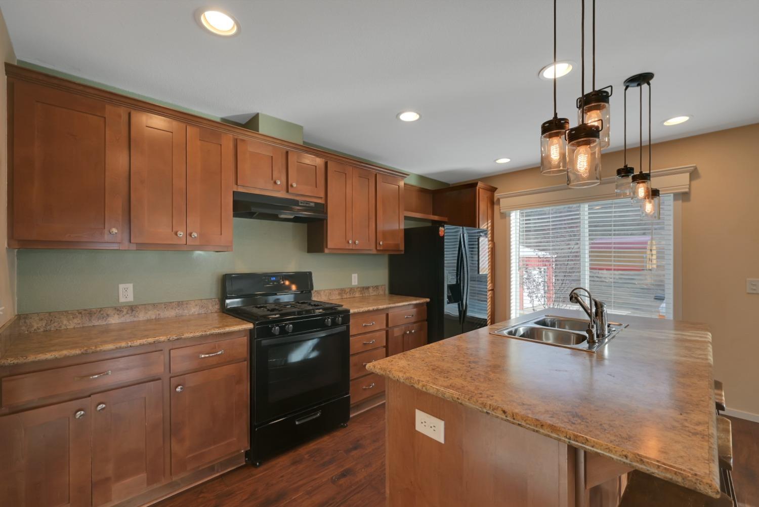 4485 Sites Lodoga Road Stonyford, CA 95979 - Photo 22 of 66 a kitchen with a sink a stove and cabinets