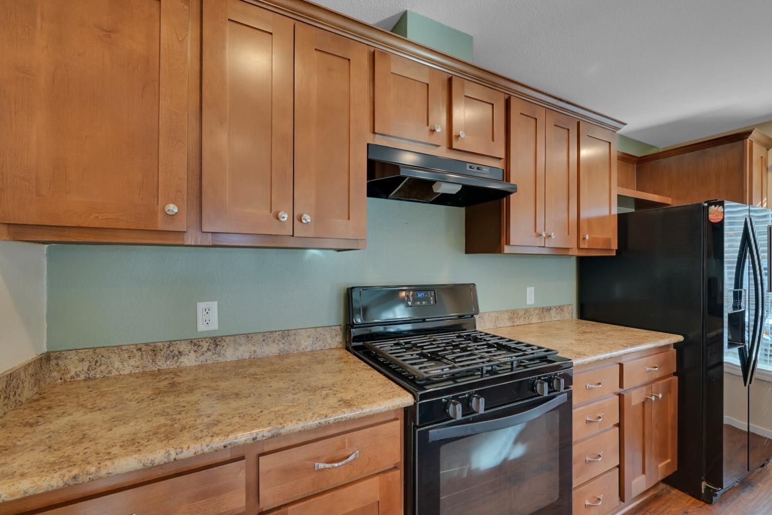 4485 Sites Lodoga Road Stonyford, CA 95979 - Photo 23 of 66 a kitchen with granite countertop cabinets stainless steel appliances and a sink