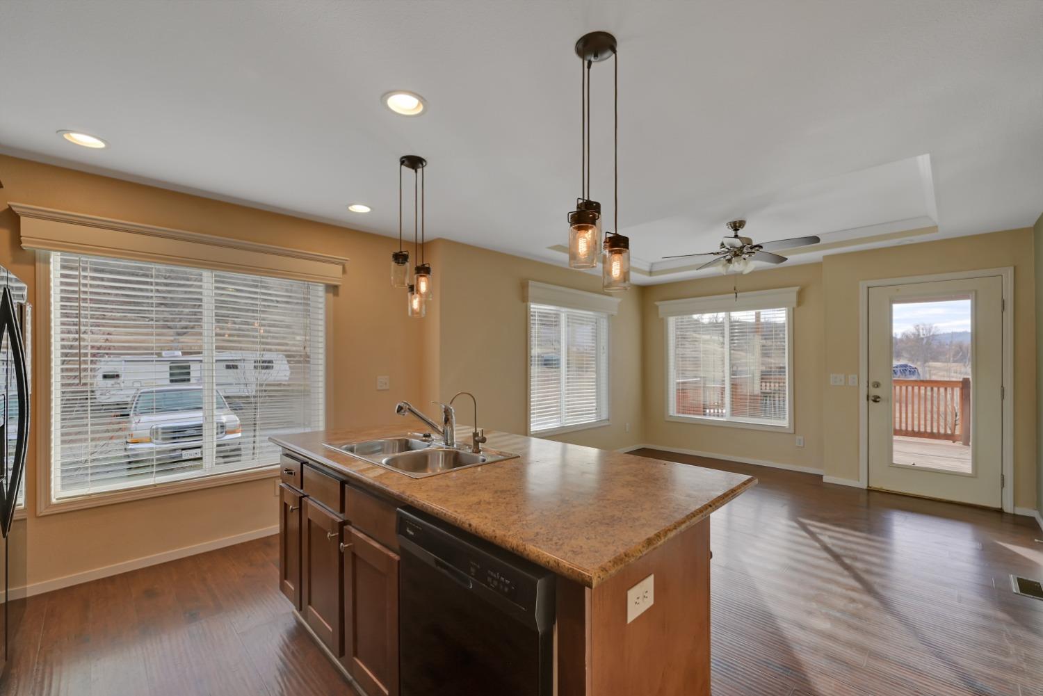 4485 Sites Lodoga Road Stonyford, CA 95979 - Photo 24 of 66 a kitchen with stainless steel appliances granite countertop a sink a oven and a wooden floor