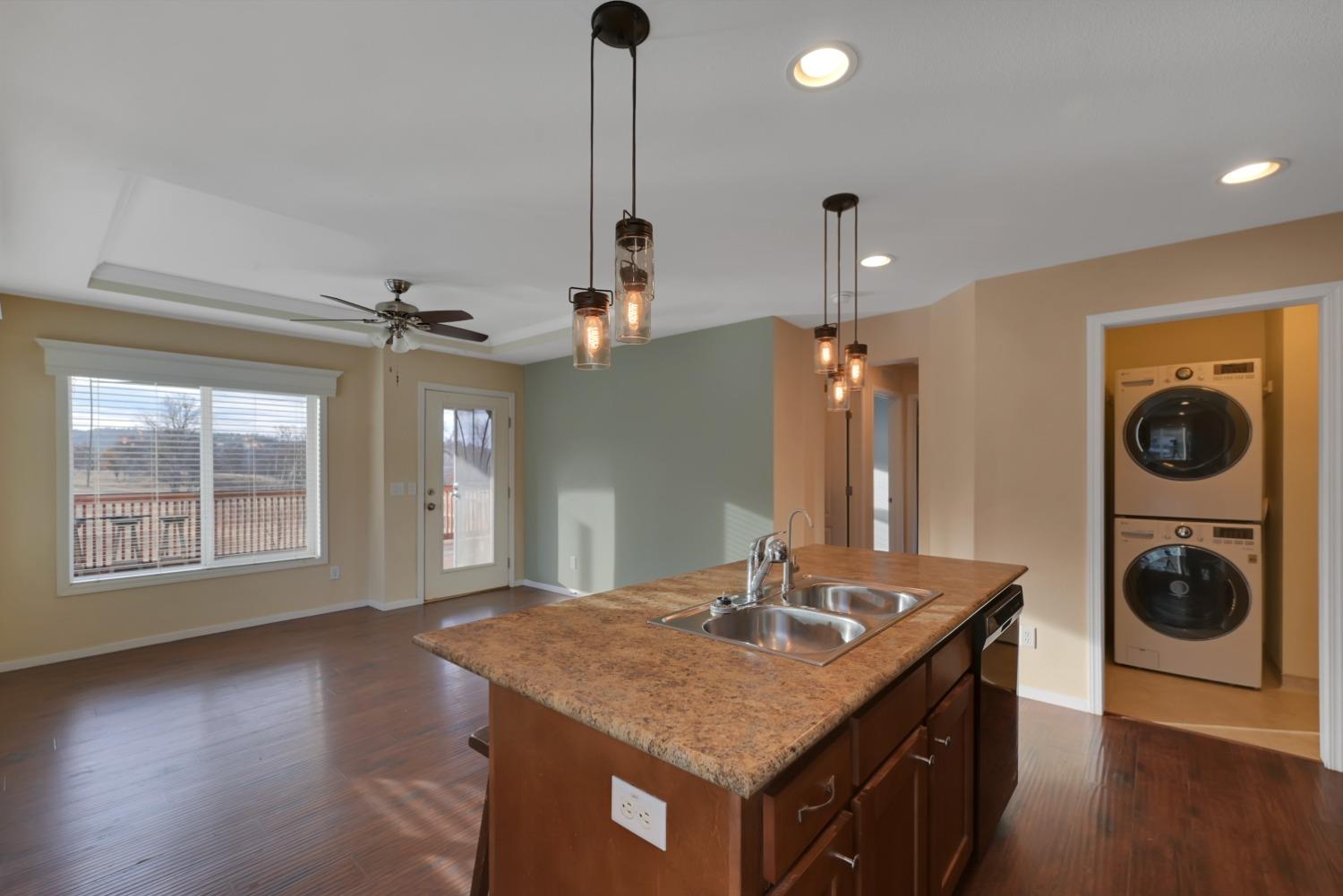 4485 Sites Lodoga Road Stonyford, CA 95979 - Photo 25 of 66 a kitchen with a sink a chandelier and wooden floor