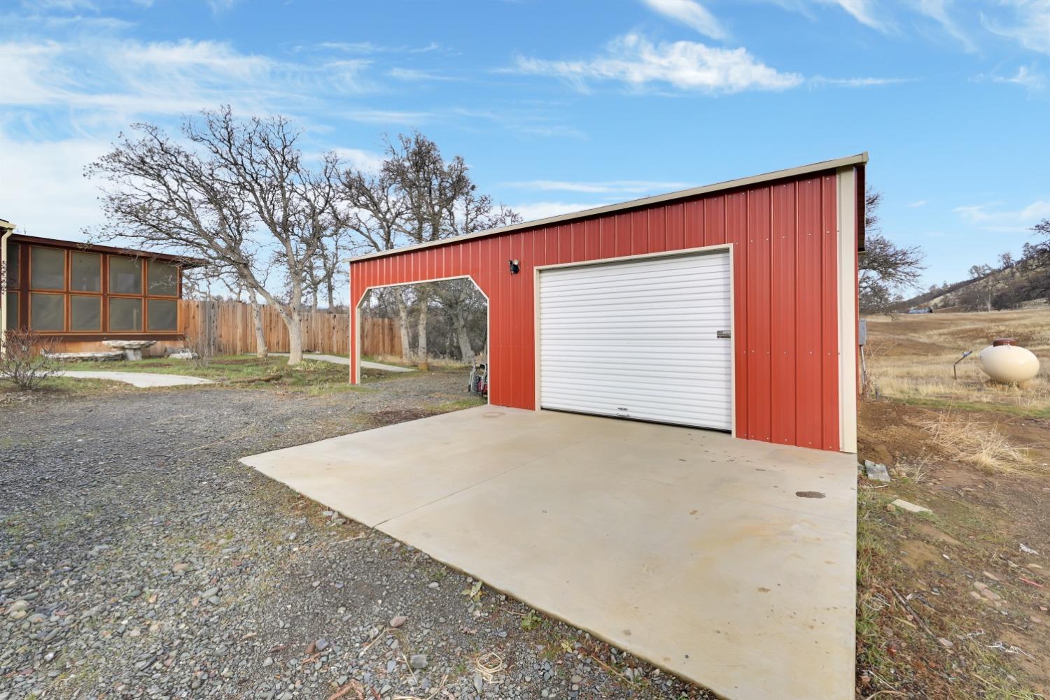 4485 Sites Lodoga Road Stonyford, CA 95979 - Photo 38 of 66 a front view of a house with a yard and garage