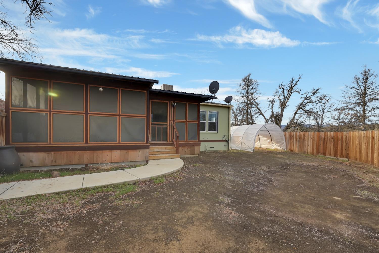 4485 Sites Lodoga Road Stonyford, CA 95979 - Photo 9 of 66 a view of a house with a backyard and a large tree