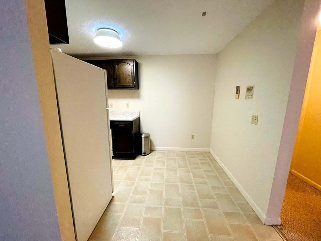 63 Leonard Road, Unit 63 Boxborough, MA 01719 - Photo 12 of 17 a bathroom with a sink and a mirror