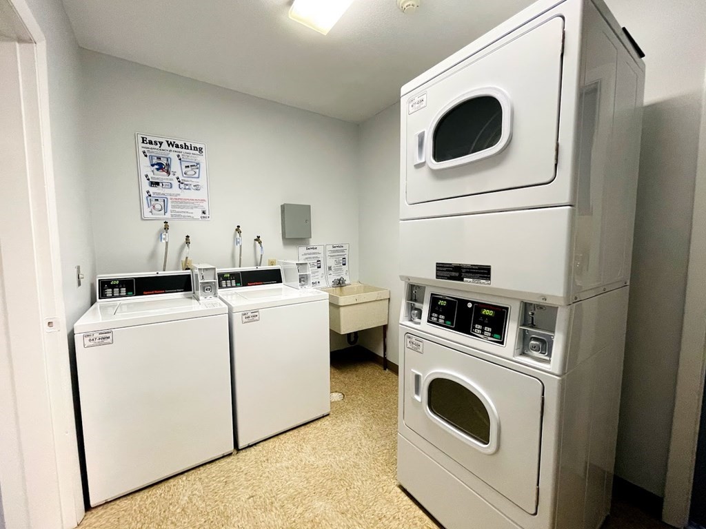63 Leonard Road, Unit 63 Boxborough, MA 01719 - Photo 17 of 17 a utility room with dryer and washer