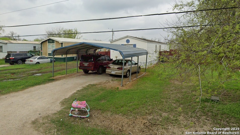 509 Maple Street Jourdanton, TX 78026 - Photo 13 of 14 a view of a street with cars