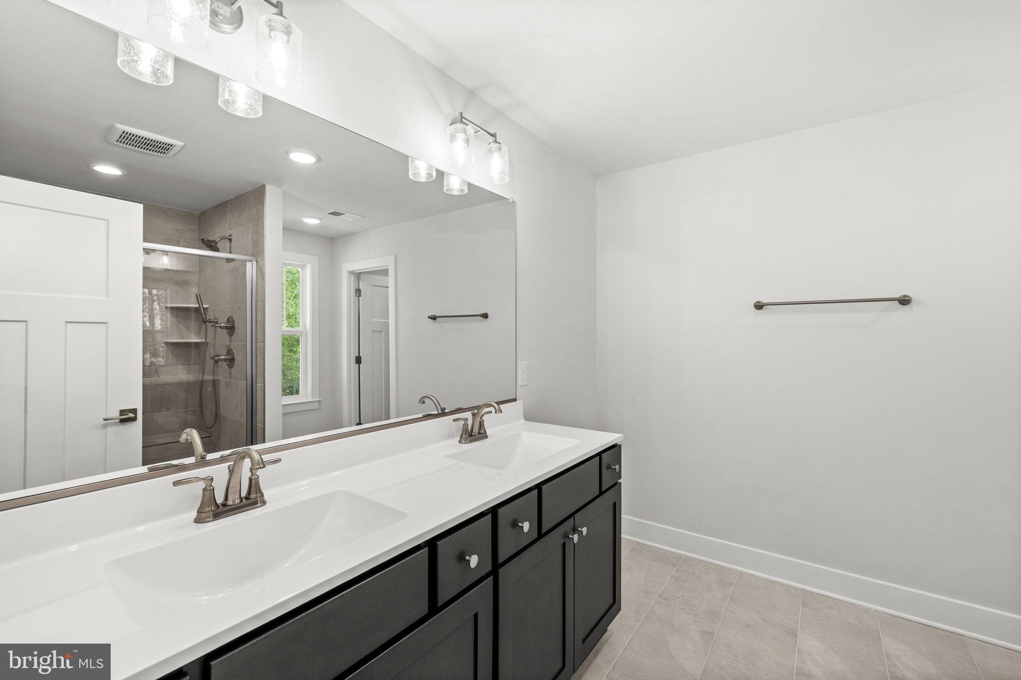 137 Indiantown Road King George, VA 22485 - Photo 21 of 31 Start and end your day in a bright, elegant bath