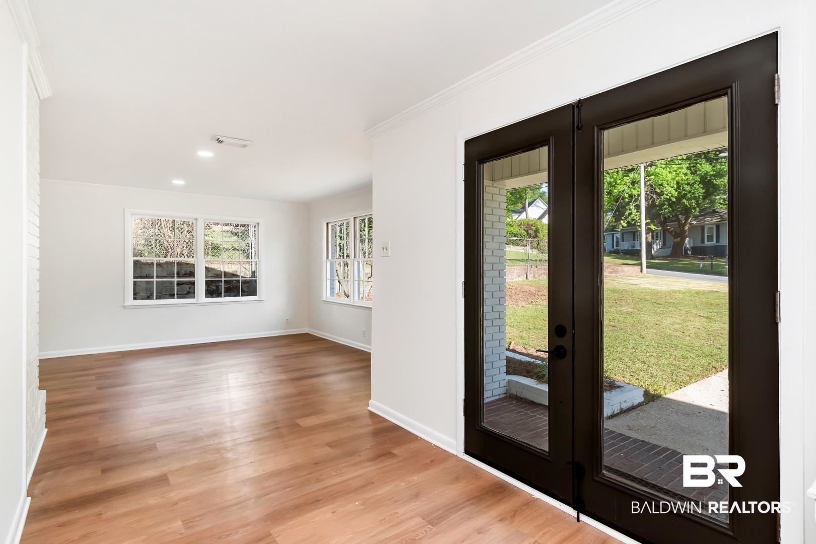 115 Pineridge Road Daphne, AL 36526 - Photo 2 of 34 Entryway with light wood finished floors, french doors, baseboards, recessed lighting, and crown molding