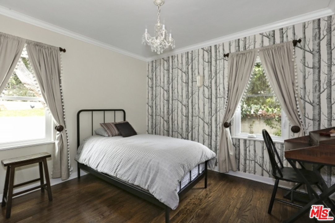 3801 Roderick Road Los Angeles, CA 90065 - Photo 21 of 38 a bedroom with a bed and a table