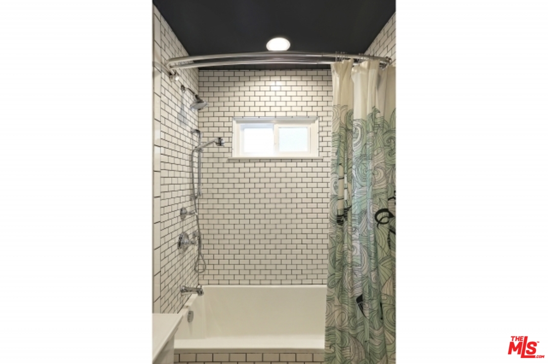 3801 Roderick Road Los Angeles, CA 90065 - Photo 24 of 38 a bathroom with a shower and a tub