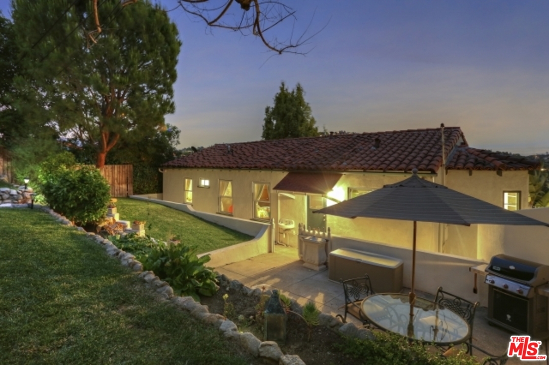 3801 Roderick Road Los Angeles, CA 90065 - Photo 29 of 38 a view of a patio with table and chairs potted plants