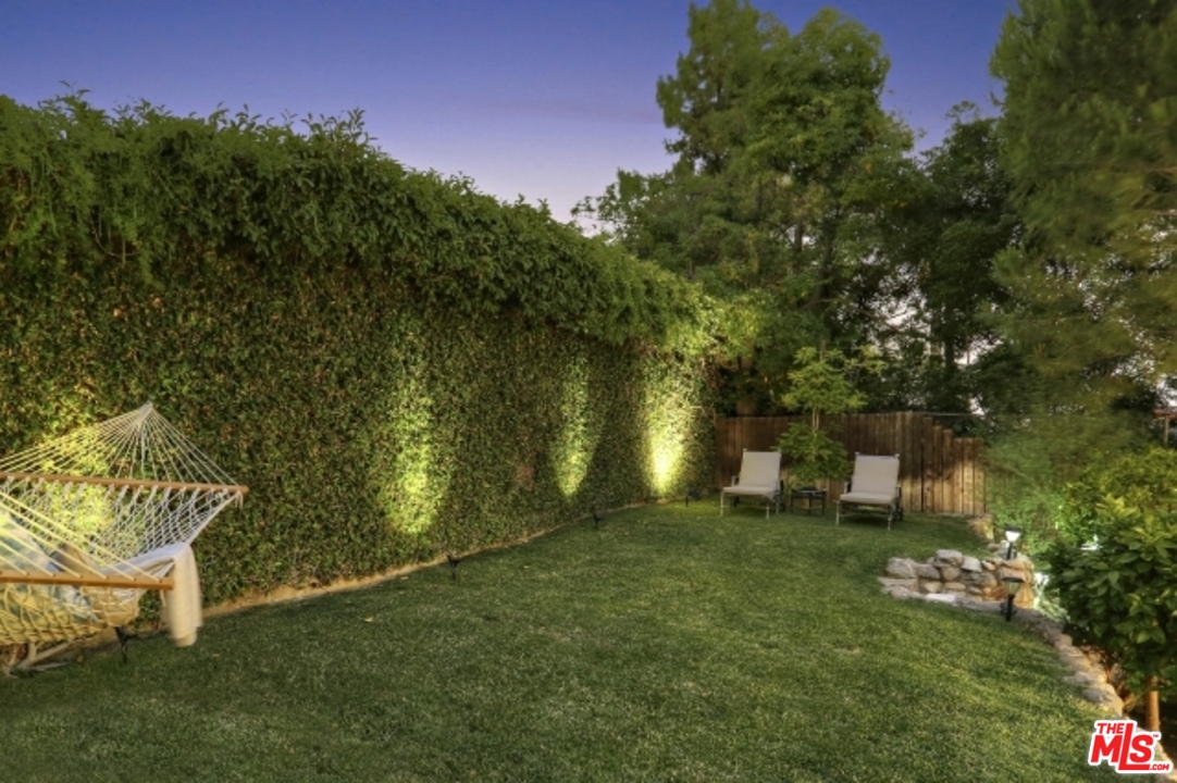 3801 Roderick Road Los Angeles, CA 90065 - Photo 31 of 38 a backyard of a house with table and chairs