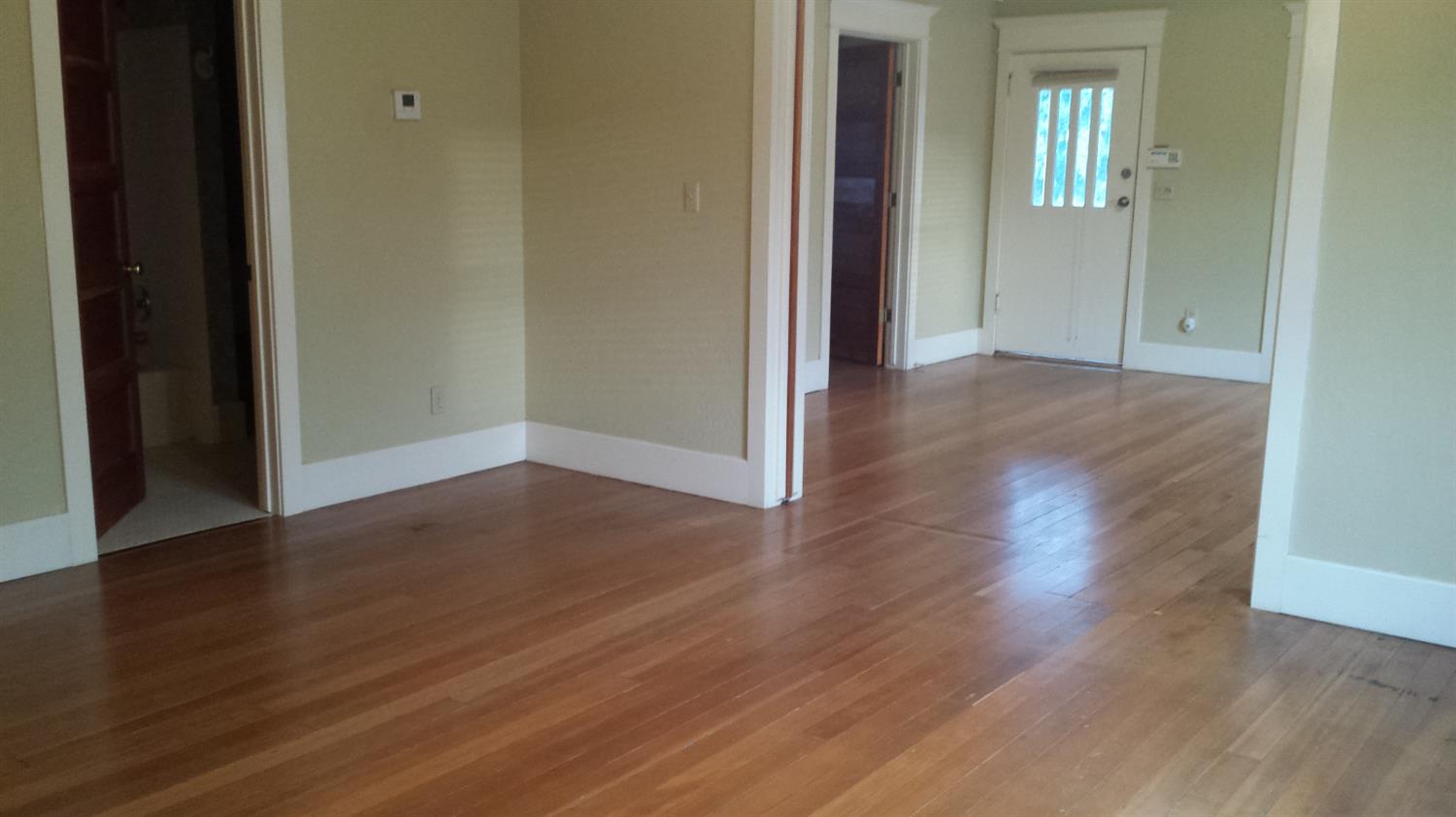 19076 East Central Avenue Reedley, CA 93654 - Photo 6 of 16 a view of a hallway with wooden floor