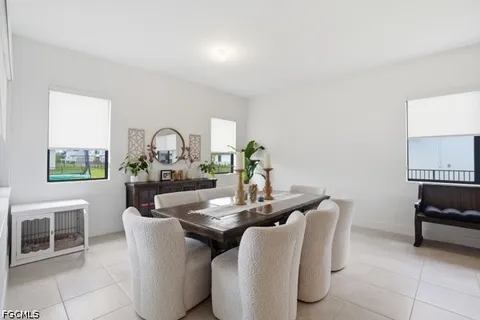 a dining room with furniture and window