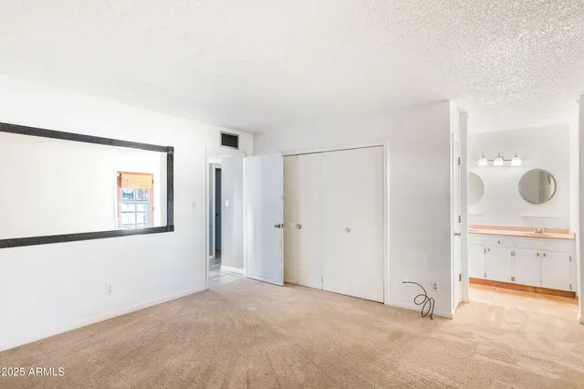 a view of a room with window cabinet and front door