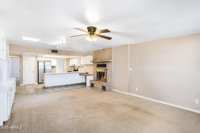 a view of a livingroom with a kitchen