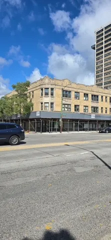 a large building with a big yard