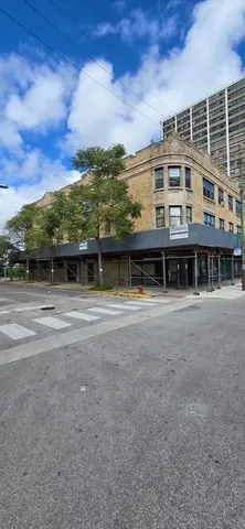 a view of a house with a small yard and plants