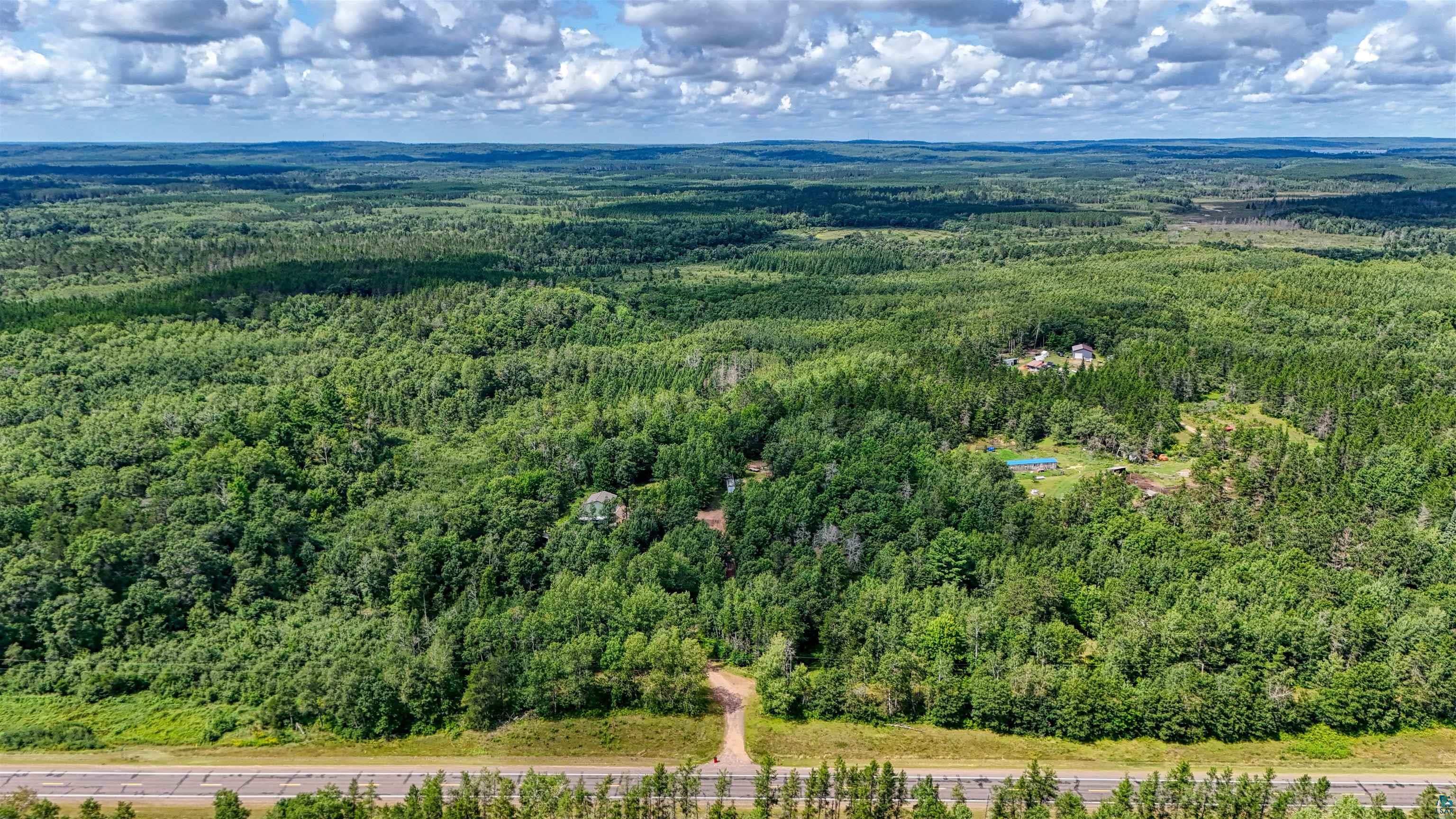 63 Highway 63 Springbrook, WI 54875 - Photo 4 of 15 Drone / aerial view of a heavily wooded area