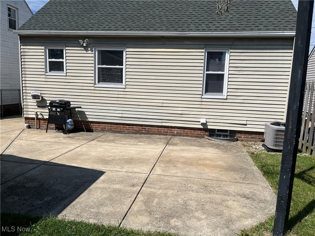 29946 Enid Road Wickliffe, OH 44092 - Photo 49 of 50 Rear view of property with central AC and a patio