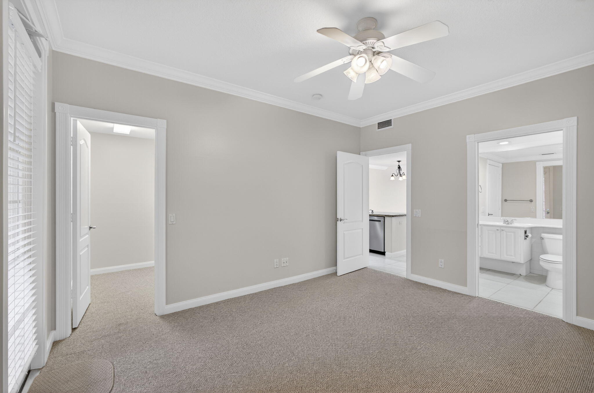 4118 Parkside Drive Jupiter, FL 33458 - Photo 13 of 73 a view of a big room with windows and a chandelier fan