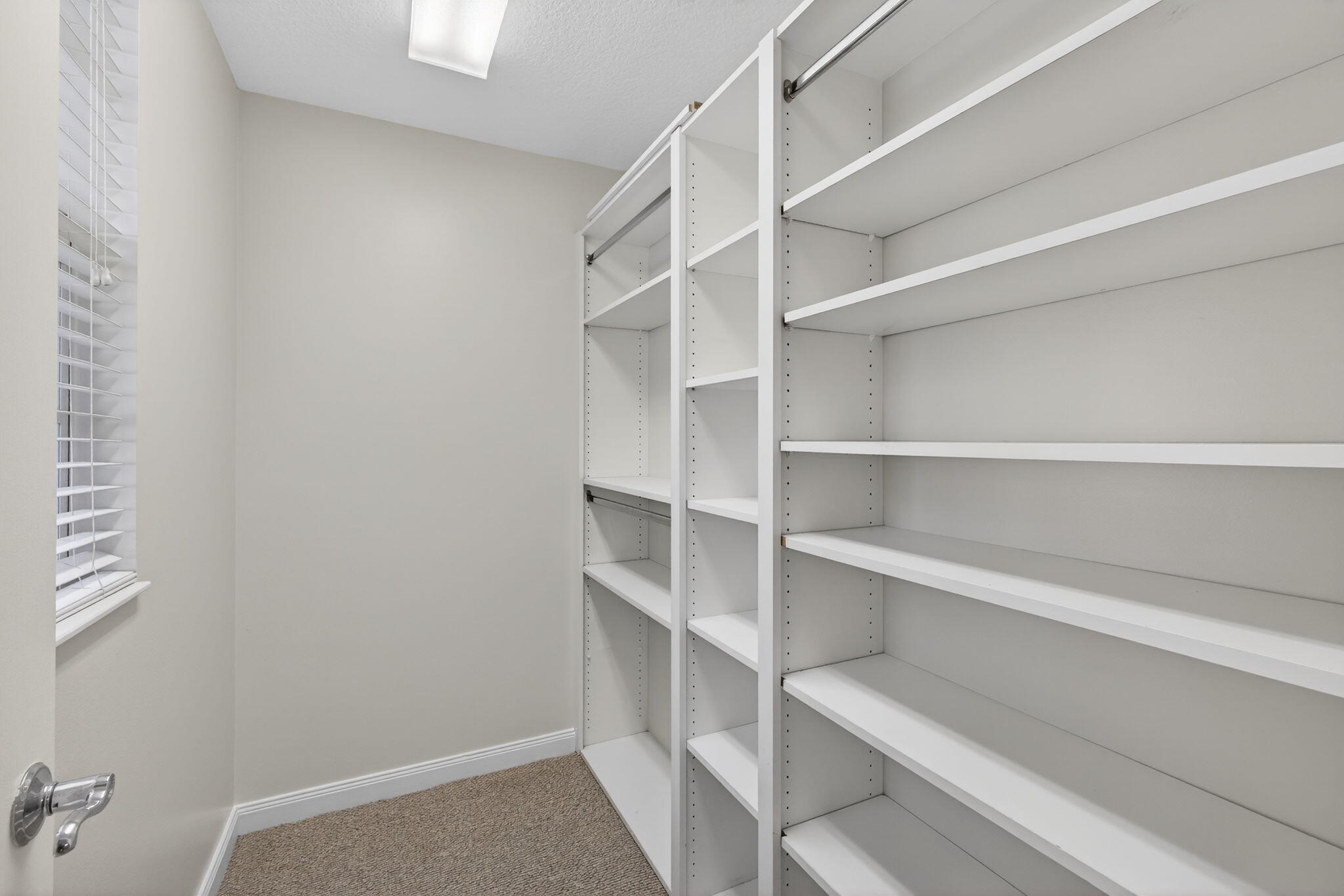 4118 Parkside Drive Jupiter, FL 33458 - Photo 15 of 73 a view of walk in closet with empty racks