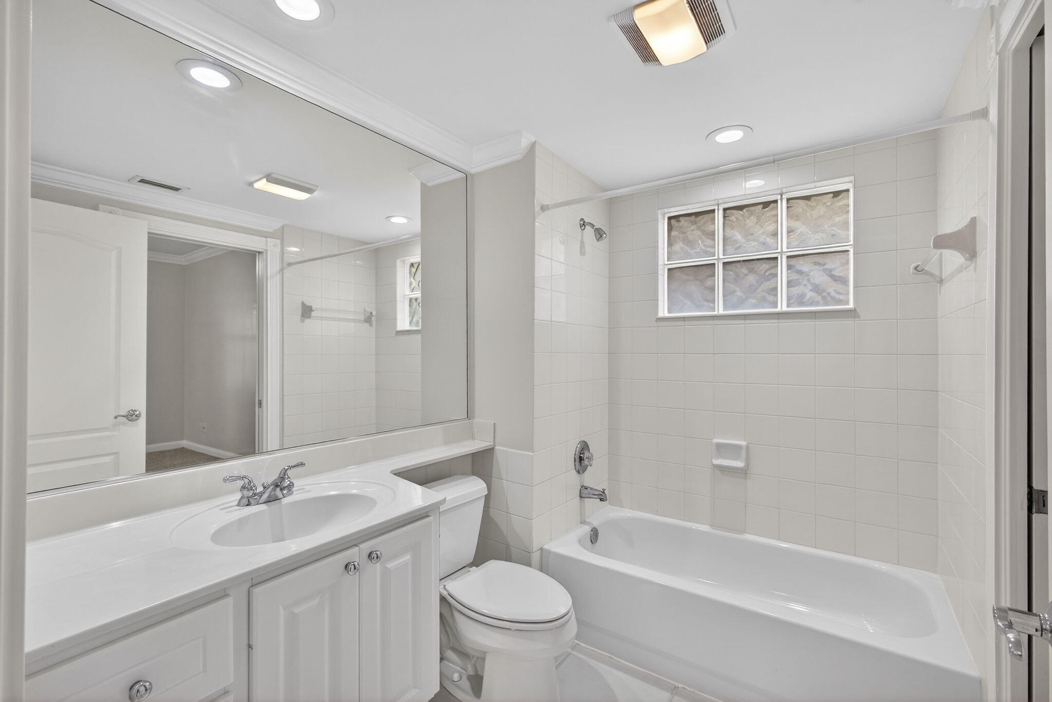 4118 Parkside Drive Jupiter, FL 33458 - Photo 18 of 73 a bathroom with a bathtub shower sink mirror and toilet