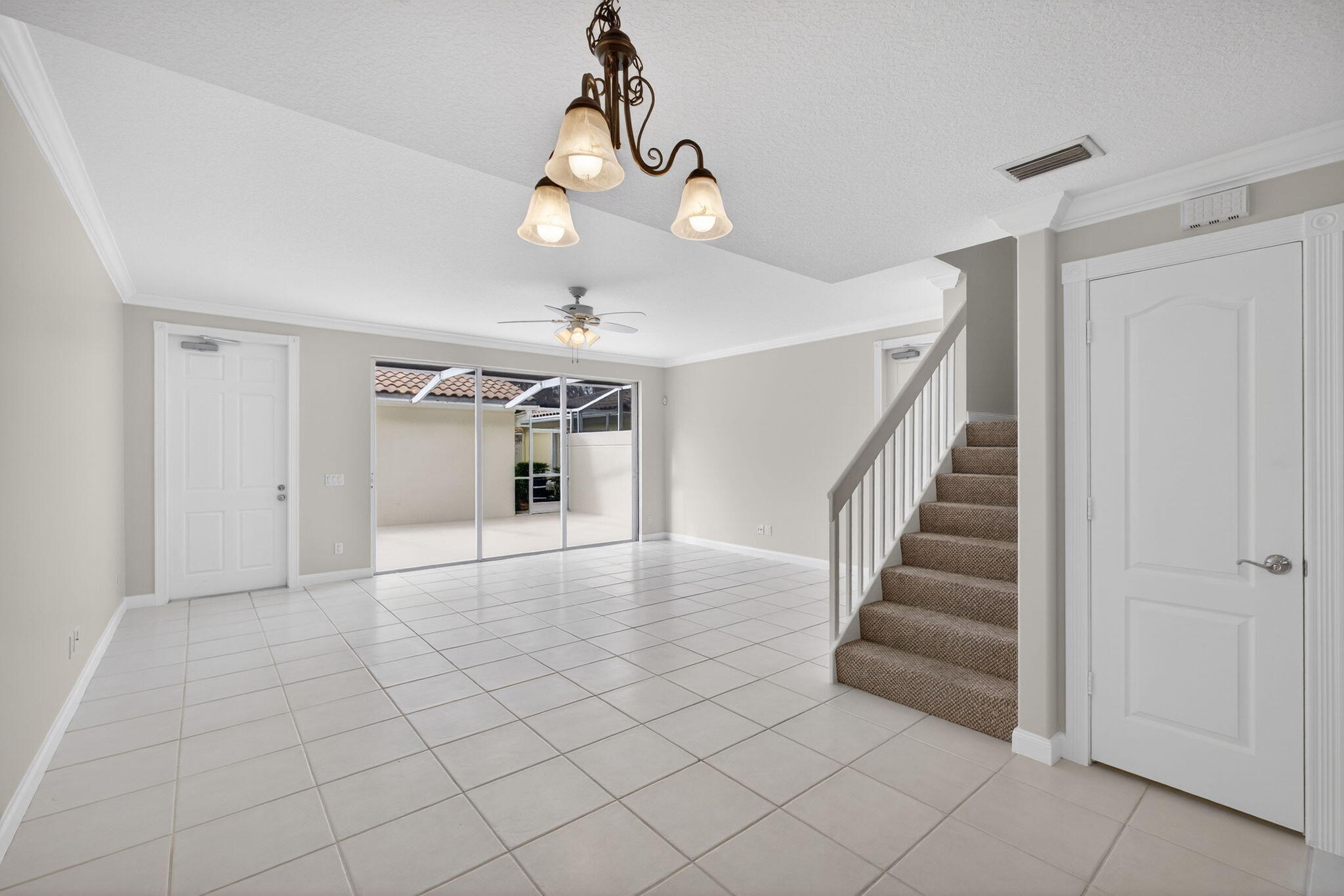 4118 Parkside Drive Jupiter, FL 33458 - Photo 19 of 73 a view of an empty room with wooden floor and stairs