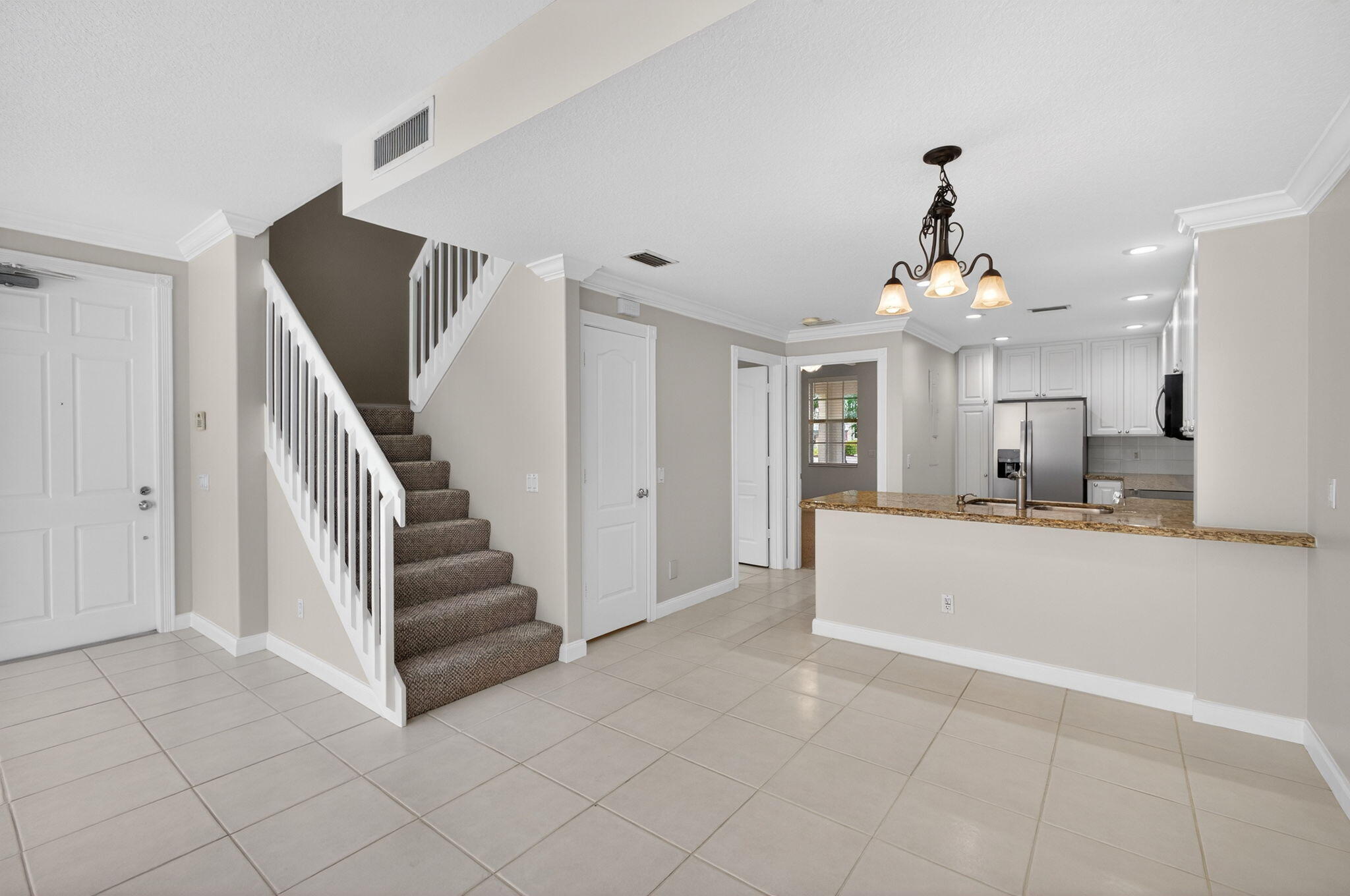 4118 Parkside Drive Jupiter, FL 33458 - Photo 20 of 73 a view of a living room and entryway