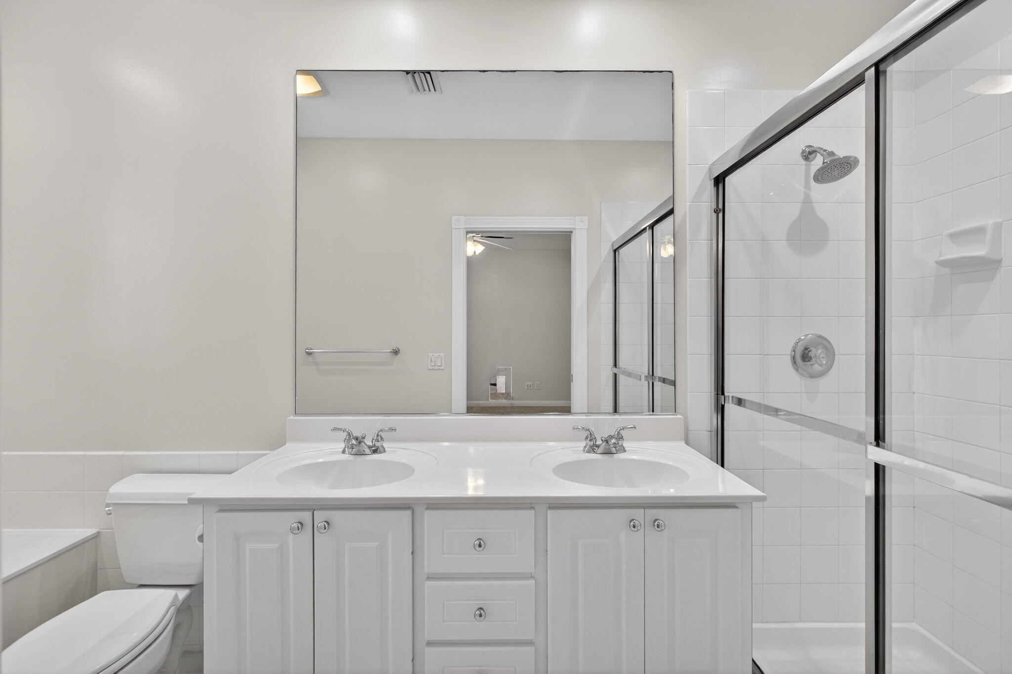 4118 Parkside Drive Jupiter, FL 33458 - Photo 30 of 73 a bathroom with a sink and mirror