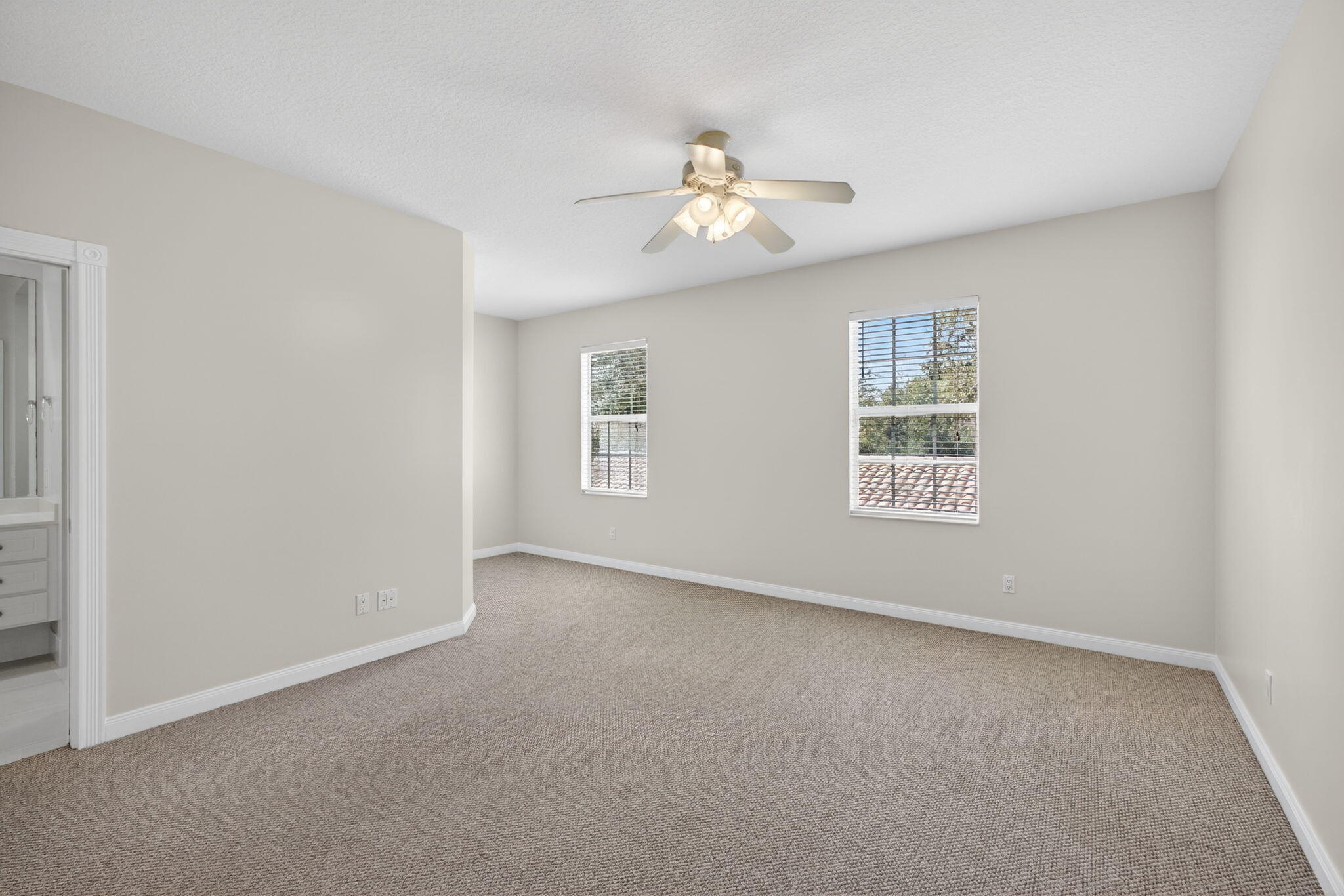 4118 Parkside Drive Jupiter, FL 33458 - Photo 36 of 73 an empty room with windows and fan