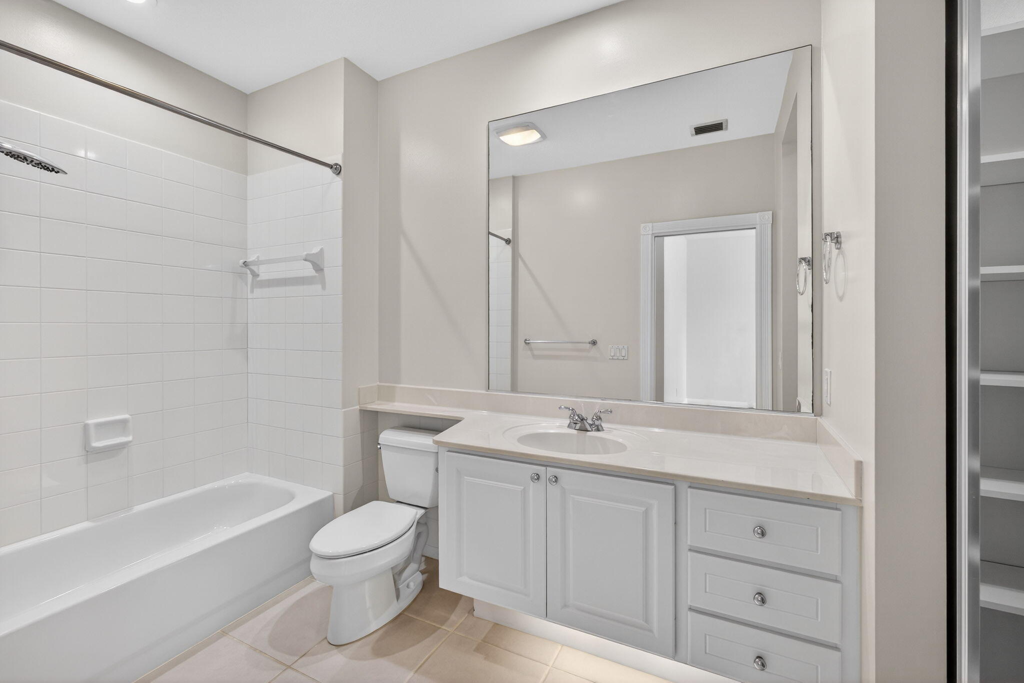 4118 Parkside Drive Jupiter, FL 33458 - Photo 38 of 73 a bathroom with a granite countertop sink a toilet and a bathtub