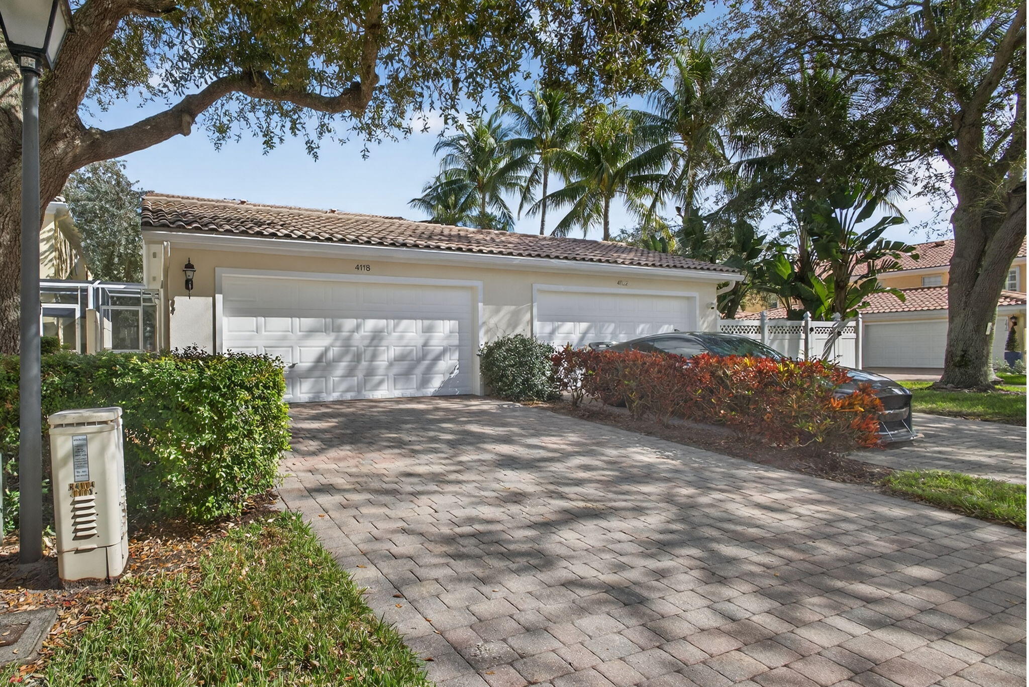 4118 Parkside Drive Jupiter, FL 33458 - Photo 51 of 73 a front view of a house with garden