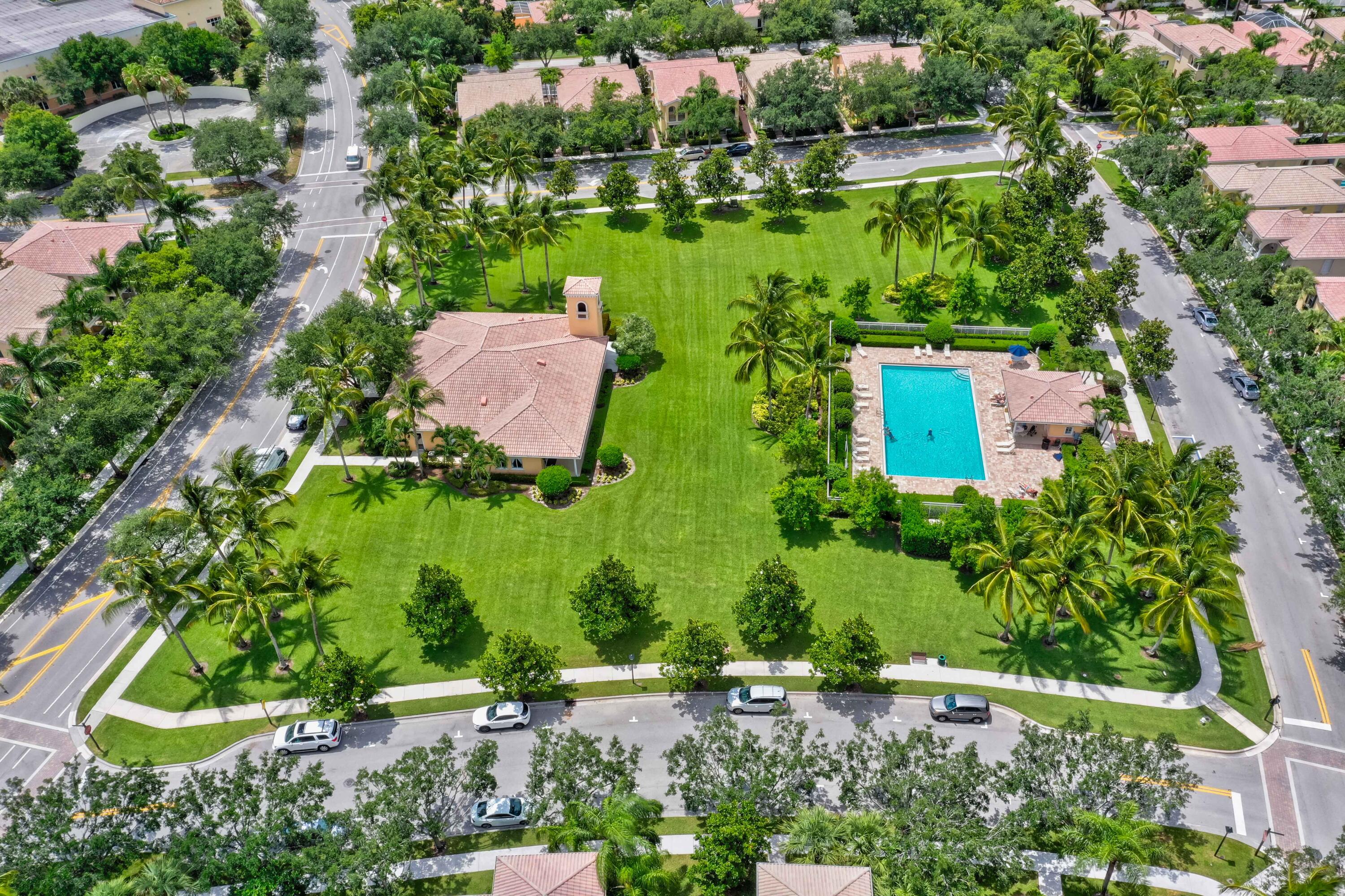 4118 Parkside Drive Jupiter, FL 33458 - Photo 57 of 73 an aerial view of a house with a yard and lake view