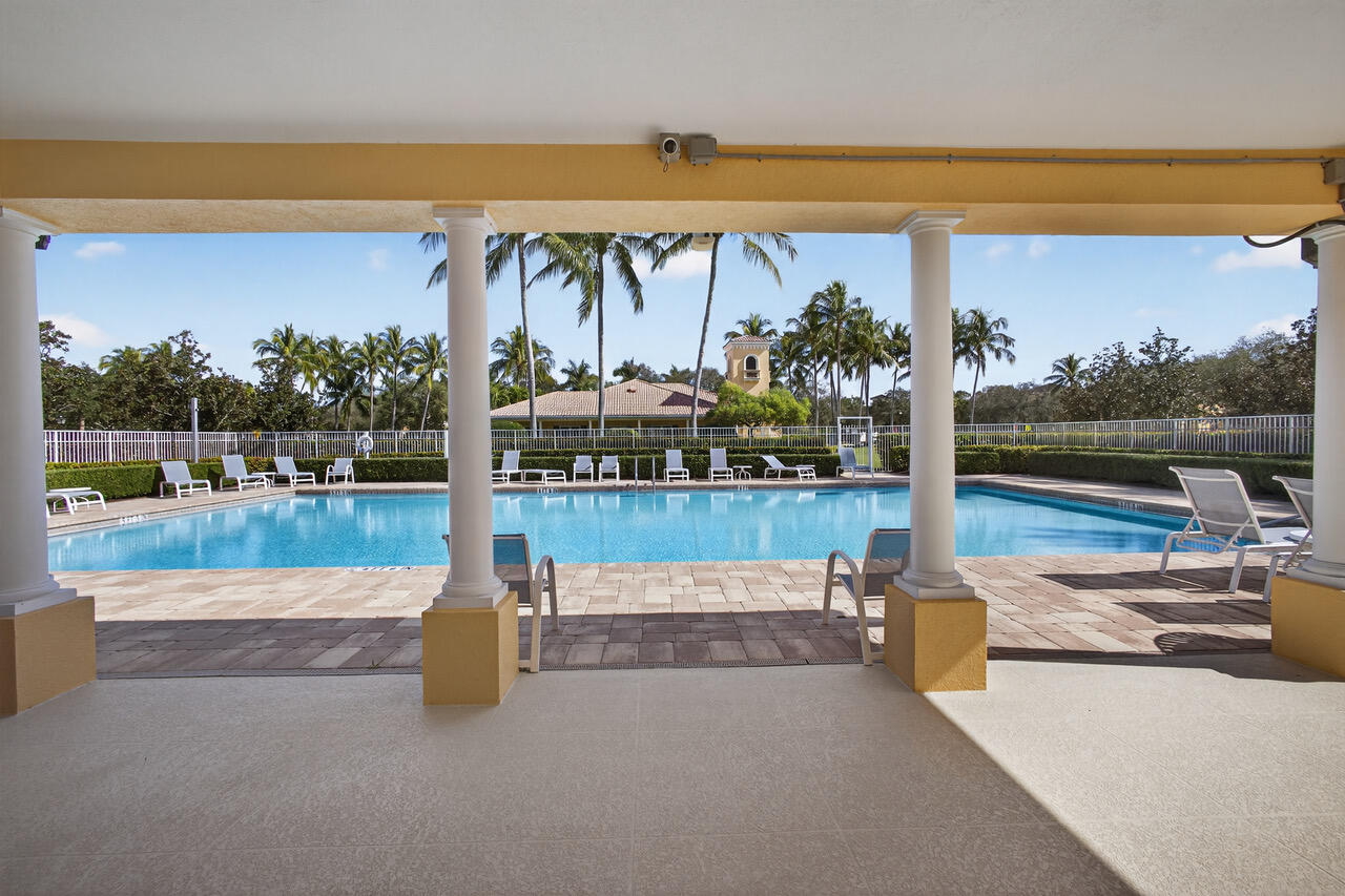4118 Parkside Drive Jupiter, FL 33458 - Photo 65 of 73 a view of a swimming pool with a patio and a ocean view