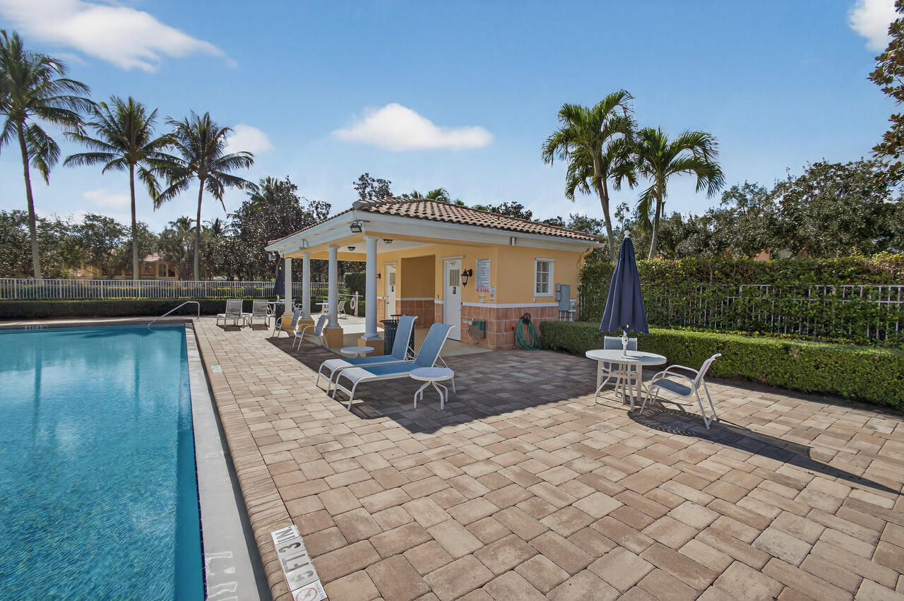 4118 Parkside Drive Jupiter, FL 33458 - Photo 67 of 73 a view of a house with swimming pool and sitting area