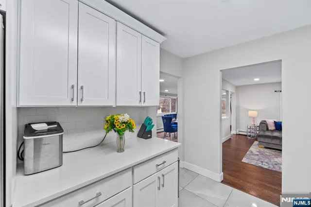 a kitchen with stainless steel appliances granite countertop a sink a cabinets counter space and a sink