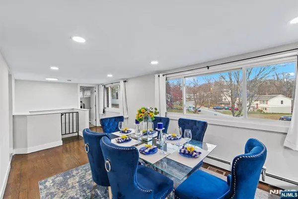 a bathroom with a sink mirror and a toilet