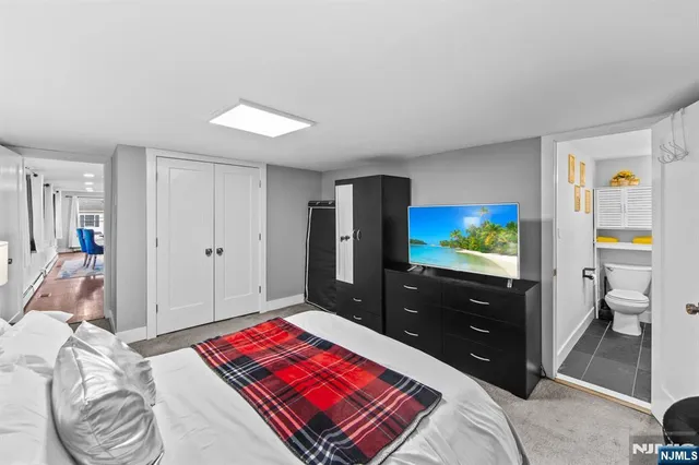 a bathroom with a toilet sink and shower