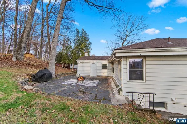a view of an entryway with wooden floor and door