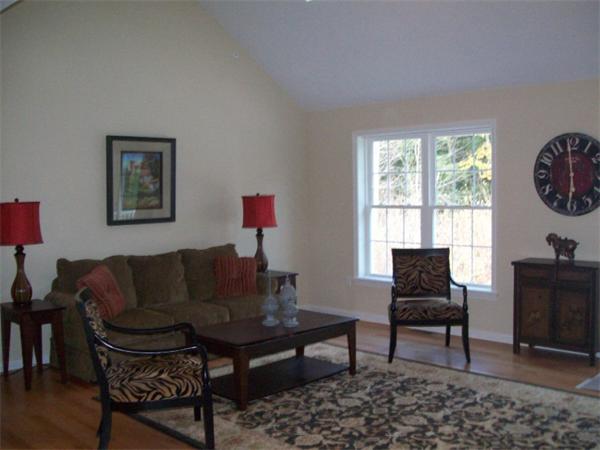 20 Riley Road, Unit 11 Lunenburg, MA 01462 - Photo 8 of 8 a living room with furniture and a window