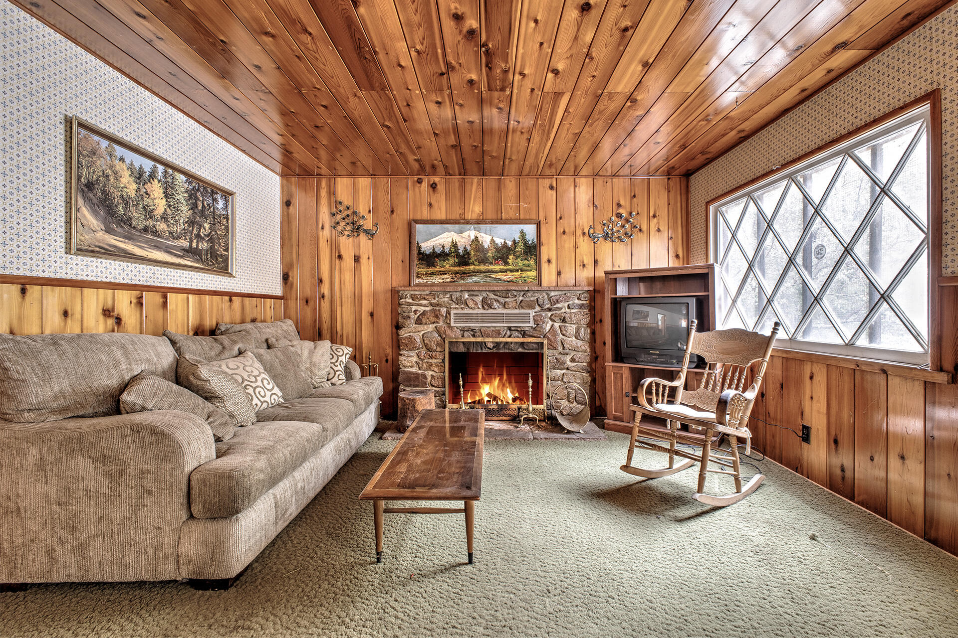 53250 Middleridge Drive Idyllwild, CA 92549 - Photo 11 of 30 a living room with furniture a fireplace and a large window