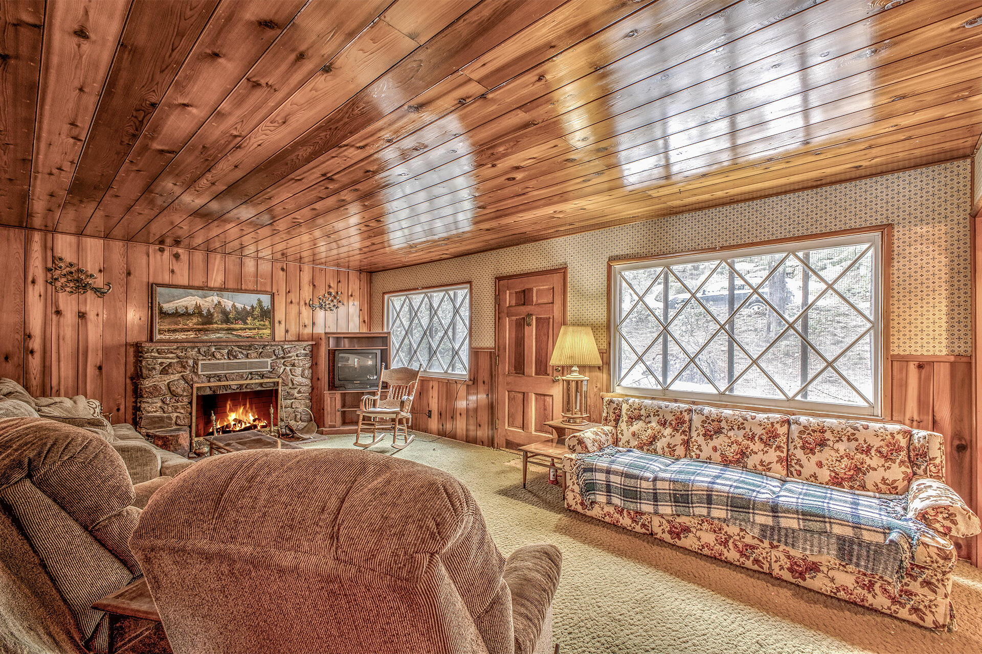 53250 Middleridge Drive Idyllwild, CA 92549 - Photo 14 of 30 a living room with furniture a fireplace and a large window