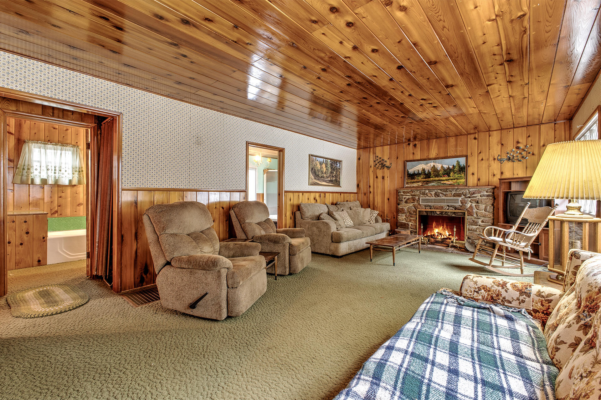 53250 Middleridge Drive Idyllwild, CA 92549 - Photo 15 of 30 a living room with furniture a fireplace and a flat screen tv