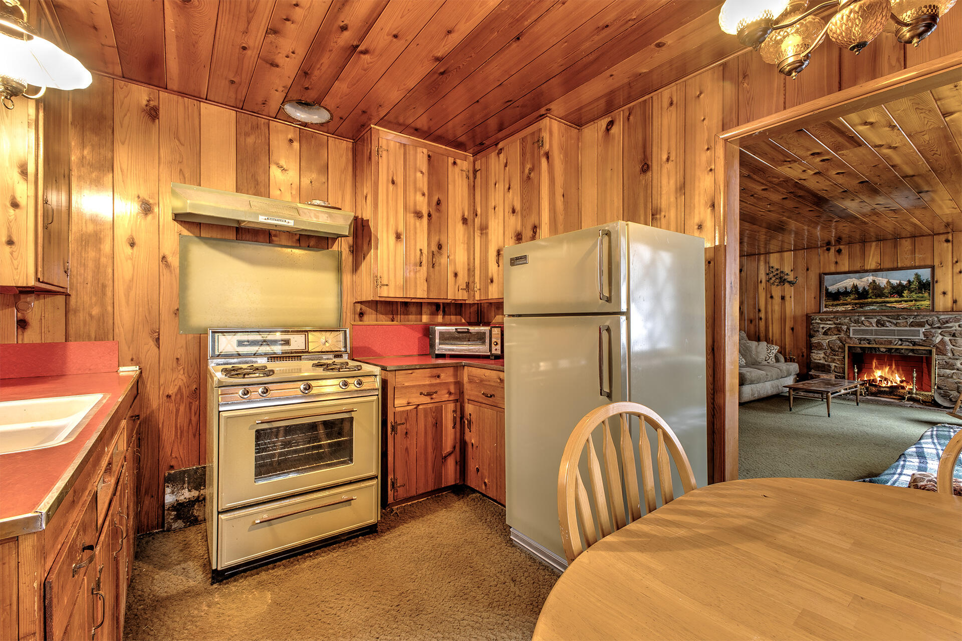 53250 Middleridge Drive Idyllwild, CA 92549 - Photo 19 of 30 a kitchen with refrigerator and stove