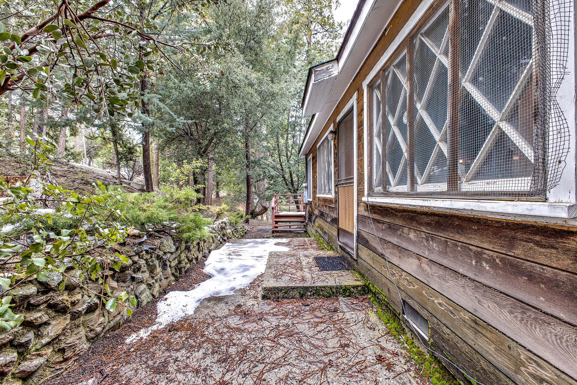 53250 Middleridge Drive Idyllwild, CA 92549 - Photo 9 of 30 a view of house with wooden stairs and a bench