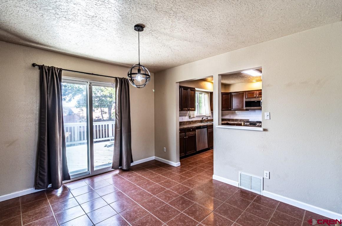 5705 Ravella Drive Farmington, NM 87402 - Photo 11 of 35 a view of kitchen with sink and refrigerator