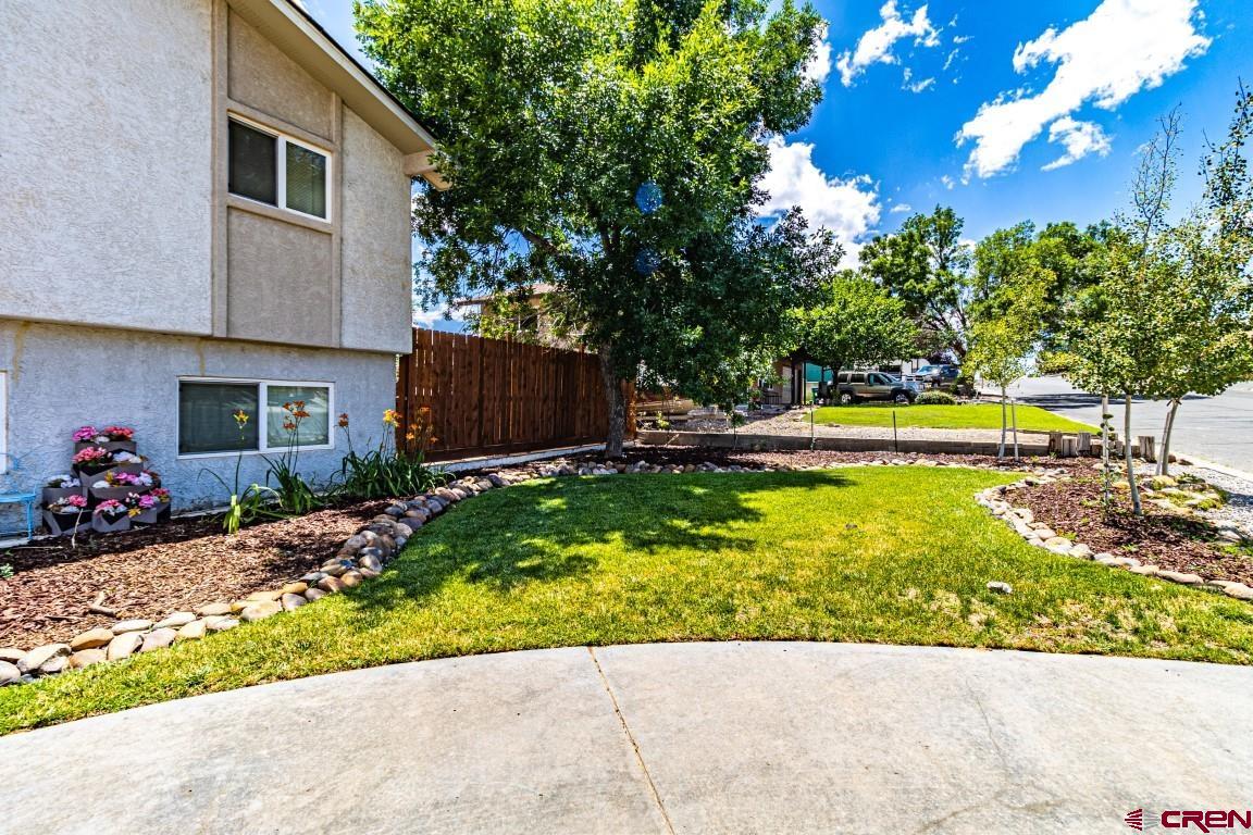 5705 Ravella Drive Farmington, NM 87402 - Photo 2 of 35 a view of a backyard with plants and a patio