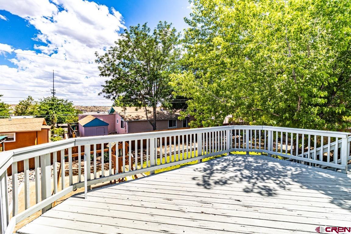 5705 Ravella Drive Farmington, NM 87402 - Photo 30 of 35 a view of a wooden roof deck