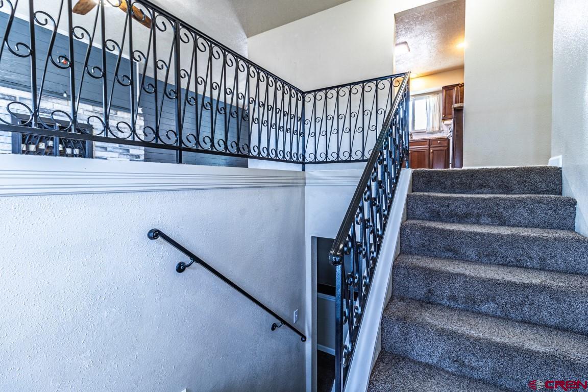 5705 Ravella Drive Farmington, NM 87402 - Photo 3 of 35 a view of entryway with wooden stairs