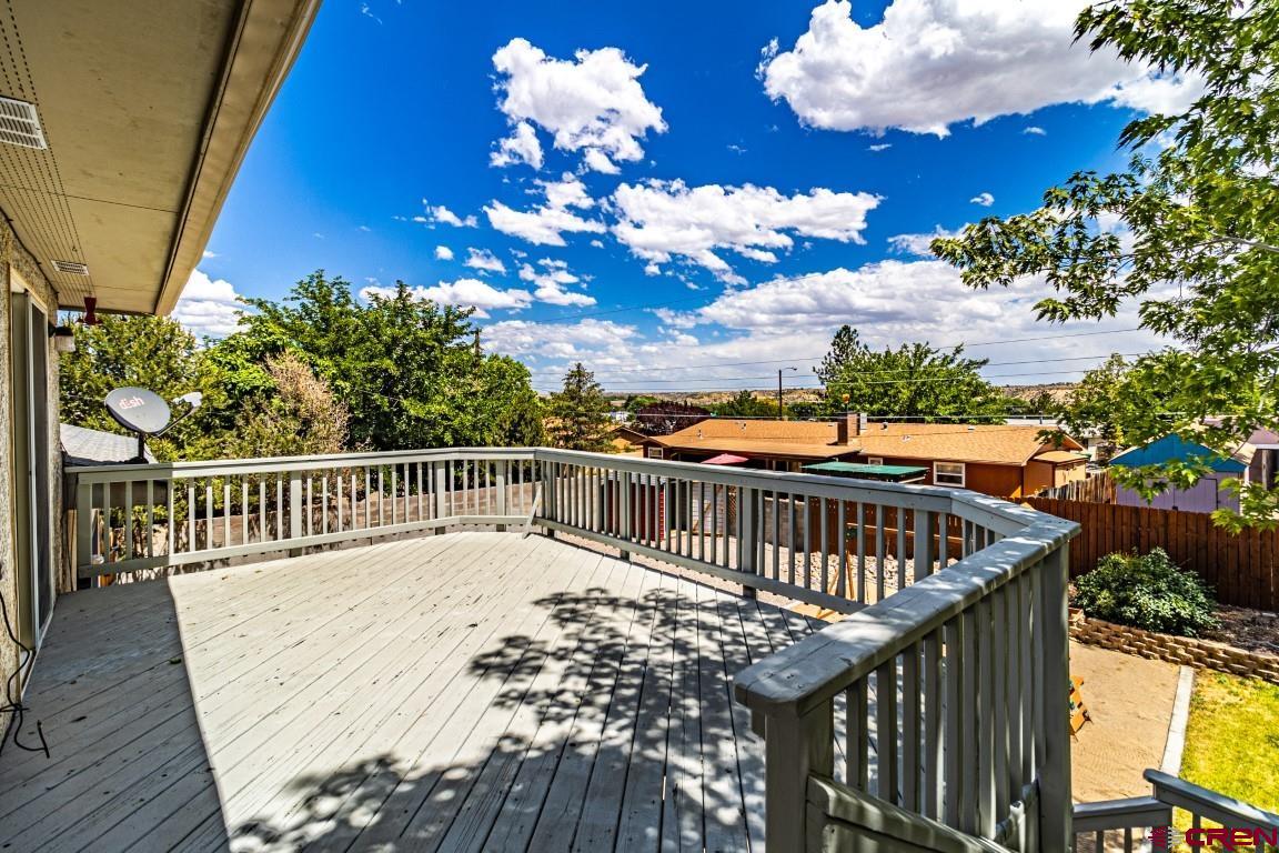 5705 Ravella Drive Farmington, NM 87402 - Photo 31 of 35 a view of a balcony with wooden floor